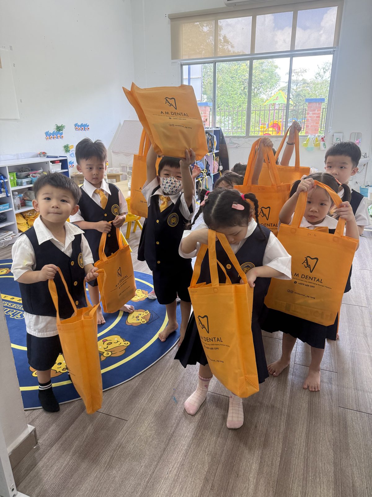 Children with their A M Dental goodie bags